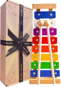Superior Sound Wooden Xylophone for Kids | Musical Instrument with Song Sheets | Educational & Fun Music Toy | Jaques of London. About this item
Baby Musical Instruments | The Jaques of London baby xylophone is a wonderful introduction to the world of music magic.
Play & Learn | Musical instruments for kids allow children to explore sound, colour and unleash creativity.
Bright Sound & Colour | Our Children’s Xylophone brings the best sound of musical toy instruments, with multi-coloured keys unveiling a vivid journey through sensory play.
Sustainable Wood | Our wooden musical toys are manufactured exclusively using environmentally responsible woods.
Present Perfection | Our toddler musical instruments are ideal educational gifts for 3 year old girls and boys. Add a Kids Xylophone to the collection of audible academics.